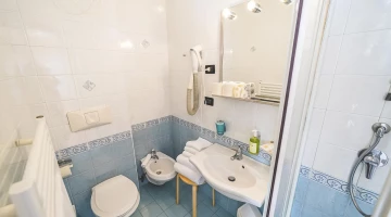 Private facilities with wall-mounted hairdryer