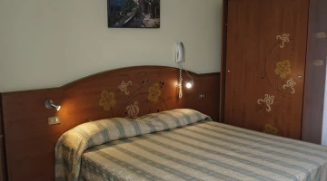 Detail of double bed in bedroom