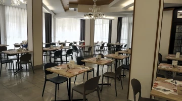 Tables set in the restaurant hall