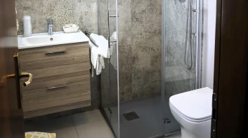 One bedroom bathroom with shower box