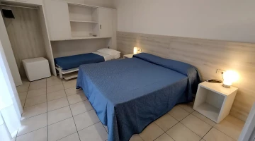 Room with three beds