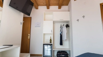 Open wardrobe and smart TV in the room