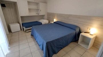 Room with three beds