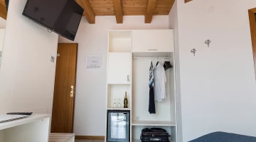Open wardrobe and smart TV in the room