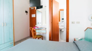 Room with TV and bathroom