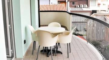 Balcony with table and chairs