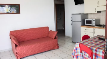 Sofa in the living area of the apartment