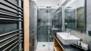 Bathroom with shower box in single room