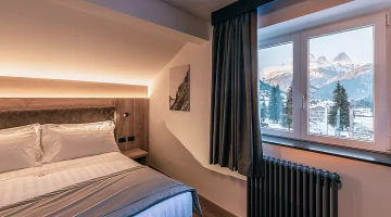 Room with window overlooking the mountain