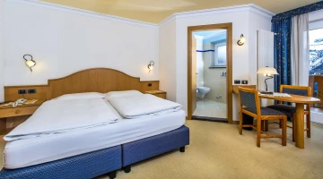Double bedroom with bathroom and table