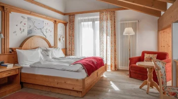 Junior Suite mit Sessel und Balkon