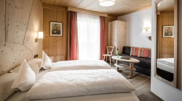 Double room with sofa and balcony