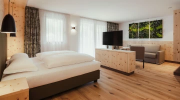Room with wooden furniture and sitting area