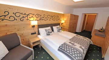 Camera matrimoniale con poltrona