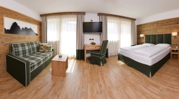 Suite matrimoniale con divano