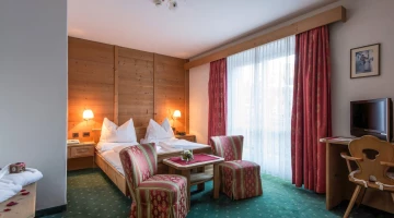Double bedroom with armchairs