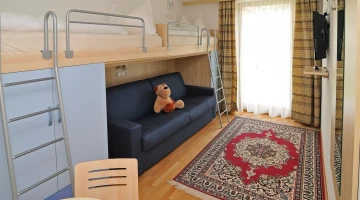 Bedroom with bunk bed in apartment