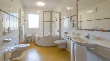 Bathroom with tub and shower
