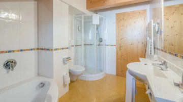 Bathroom with shower and bathtub