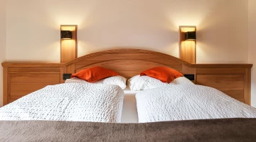 Detail of double bed in bedroom