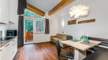 Living room with kitchen and balcony in apartment