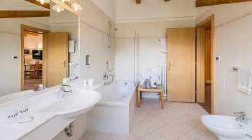 Bathroom with bathtub in suite