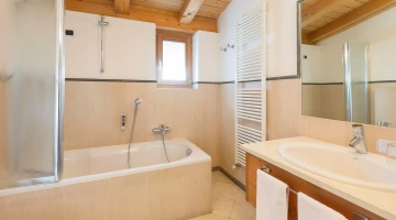 Bathroom with bathtub in double bedroom