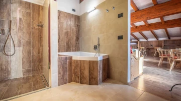 Private bathroom with shower and bathtub