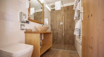 Private facilities with shower box and wall-mounted hairdryer