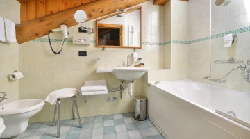 Bathroom with hairdryer and bathtub