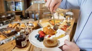 Breakfast with sweet and savoury products on buffet