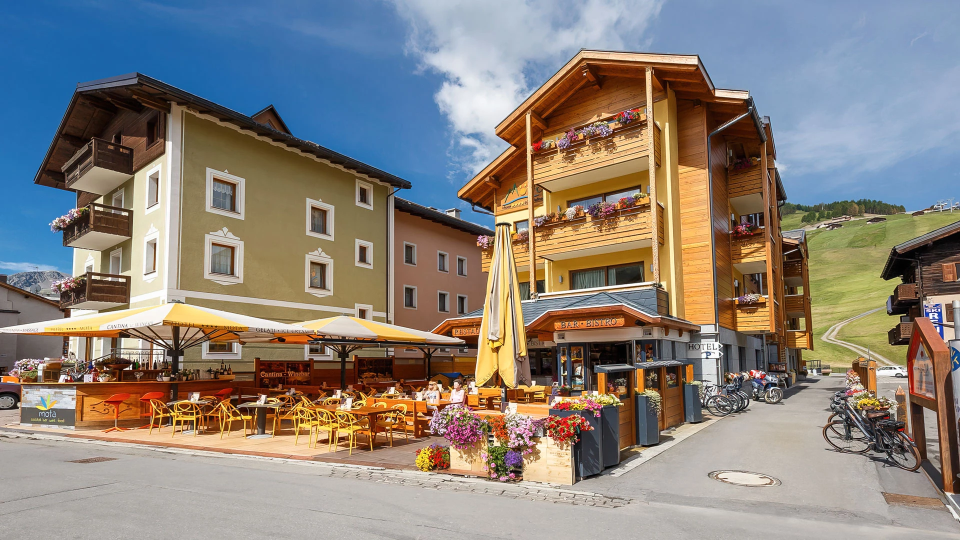 Hotel with terrace and bar tables