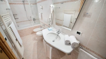 One bedroom bathroom with tub and shower