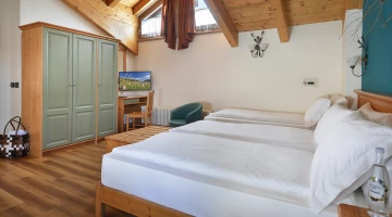Triple room with exposed beams