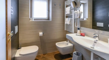 Private facilities with wall-mounted hairdryer