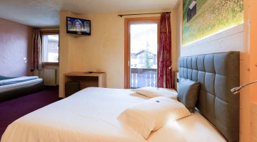 Room with three beds