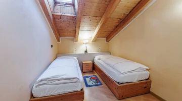 Double room with single beds in apartment