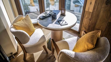 Coffee table with armchairs in a room