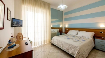 Double bedroom with TV in apartment