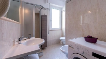 Apartment with washing machine and bathroom