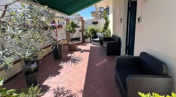 Outdoor spaces furnished with sofas