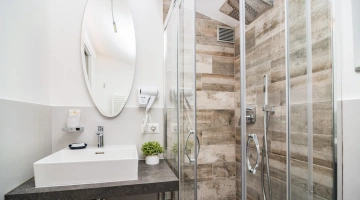 Private bathroom with shower and hairdryer