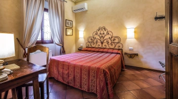 Room with wrought iron bed