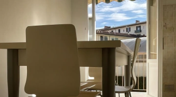 Kitchen with dining table and balcony