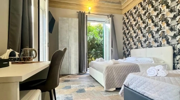 Dreibettzimmer mit Balkon