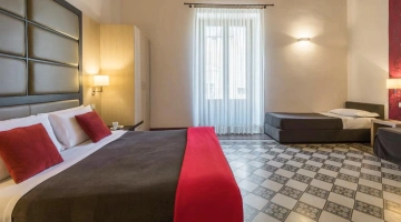 Stanza con tre posti letto