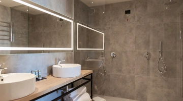 Private bathroom with double sink in Suite