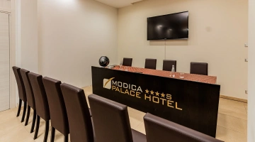 Meeting room with TV and microphones