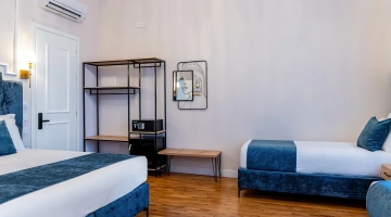 Chambre quadruple avec coffre-fort et minibar