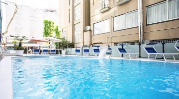 Swimming pool with waterfalls and solarium
